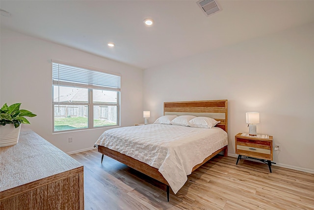 bedroom with light wood-type flooring