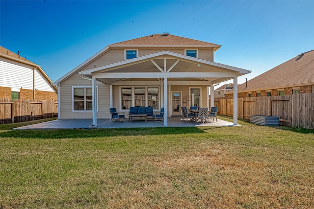 back of property featuring outdoor lounge area, a patio, and a lawn