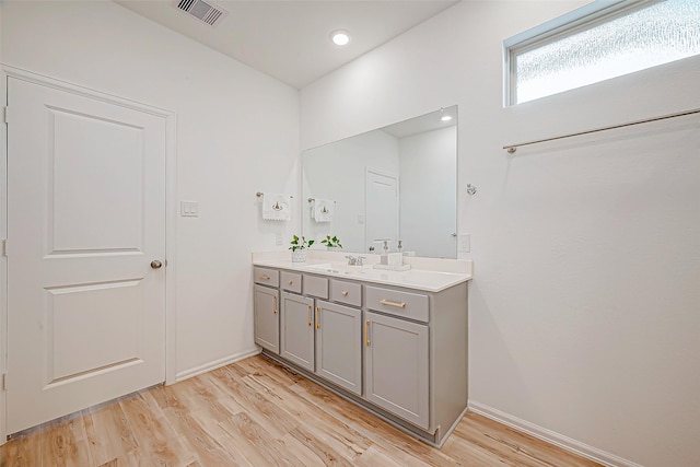 bathroom with vanity and hardwood / wood-style flooring