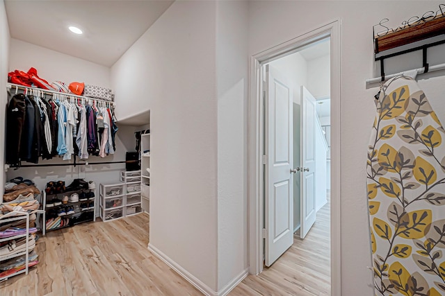 walk in closet featuring light hardwood / wood-style floors