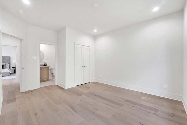 unfurnished room with light hardwood / wood-style flooring