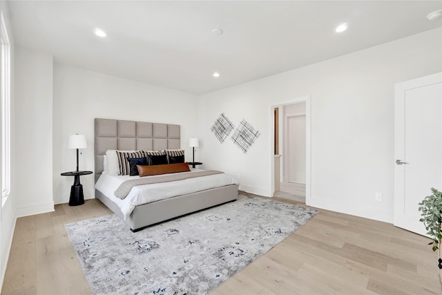 bedroom with light hardwood / wood-style floors