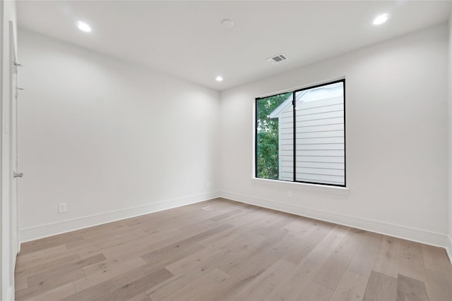 unfurnished room featuring light hardwood / wood-style flooring