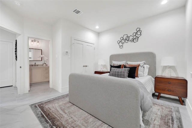 bedroom featuring ensuite bath