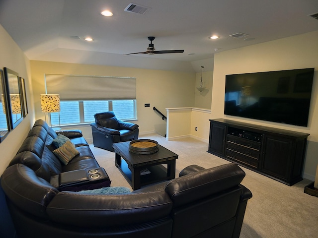 living room with light carpet, ceiling fan, and lofted ceiling