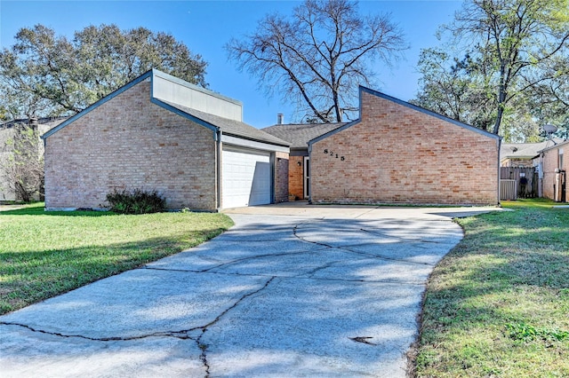 view of side of home featuring a yard and a garage