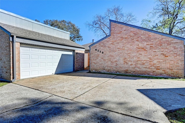 view of side of property with a garage