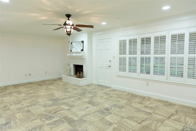 unfurnished living room with ceiling fan