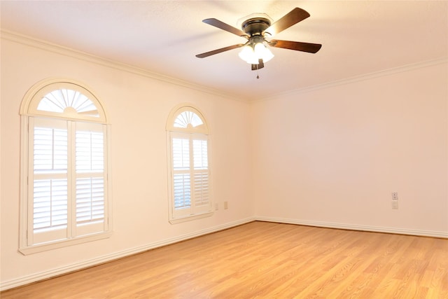 unfurnished room featuring ceiling fan, light wood-type flooring, and ornamental molding