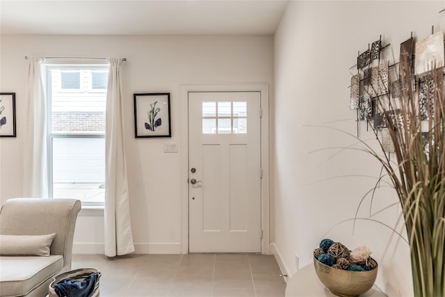 foyer featuring light tile patterned flooring