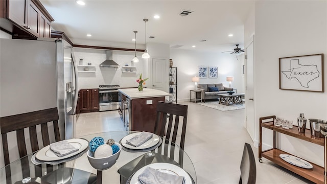 dining space featuring ceiling fan and light tile patterned flooring