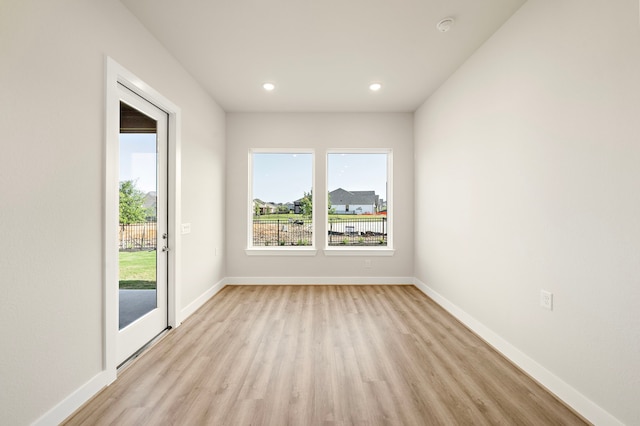 9760 Rockwell Dr, Willis, TX 77318 - unfurnished room with light wood finished floors, recessed lighting, and a smoke detector