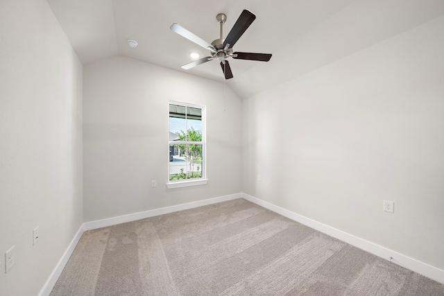 9760 Rockwell Dr, Willis, TX 77318 - carpeted spare room featuring vaulted ceiling and a ceiling fan