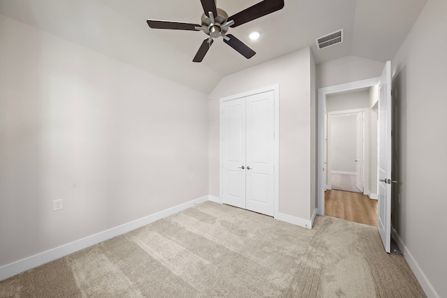 9760 Rockwell Dr, Willis, TX 77318 - unfurnished bedroom featuring carpet floors, lofted ceiling, a closet, and a ceiling fan