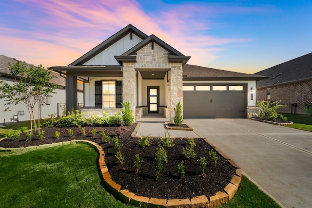 9760 Rockwell Dr, Willis, TX 77318 - view of front facade with stone siding, board and batten siding, a garage, and driveway