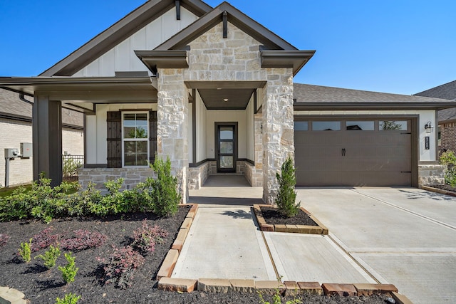 9760 Rockwell Dr, Willis, TX 77318 - view of front facade featuring stone siding, board and batten siding, and a garage