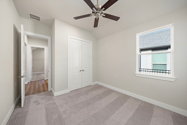 9760 Rockwell Dr, Willis, TX 77318 - unfurnished bedroom featuring light colored carpet, a closet, and ceiling fan