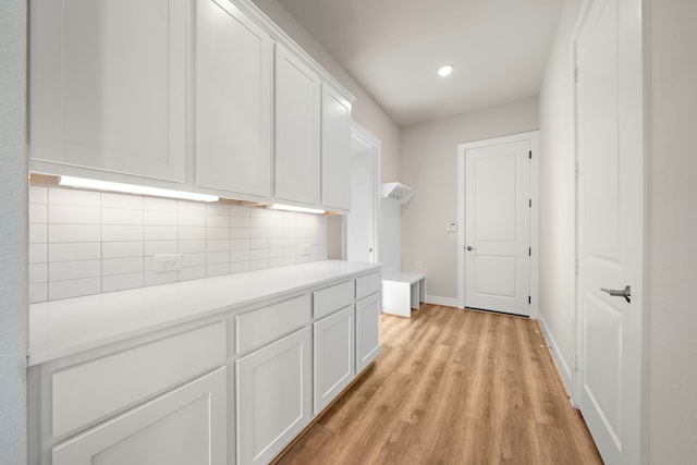 9760 Rockwell Dr, Willis, TX 77318 - hallway with light wood finished floors and recessed lighting