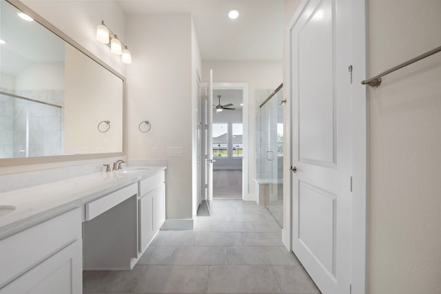 9760 Rockwell Dr, Willis, TX 77318 - bathroom with double vanity, a stall shower, tile patterned flooring, a ceiling fan, and recessed lighting