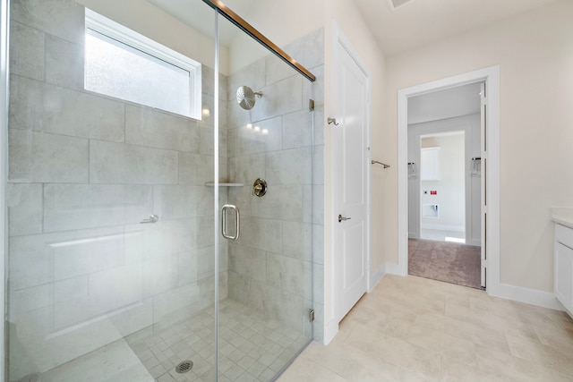 9760 Rockwell Dr, Willis, TX 77318 - full bath featuring a shower stall, vanity, and tile patterned floors