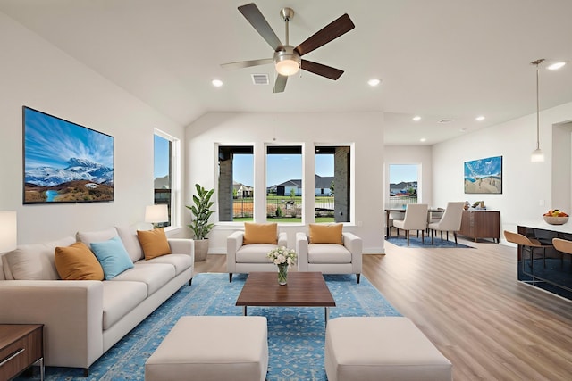 9760 Rockwell Dr, Willis, TX 77318 - living area with wood finished floors, a ceiling fan, and recessed lighting
