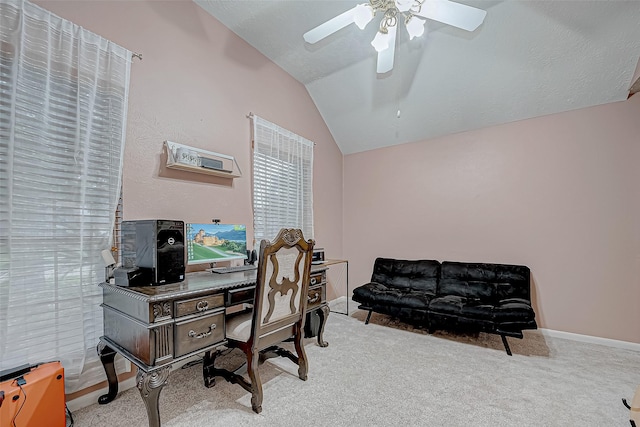 office area with ceiling fan, light colored carpet, and vaulted ceiling