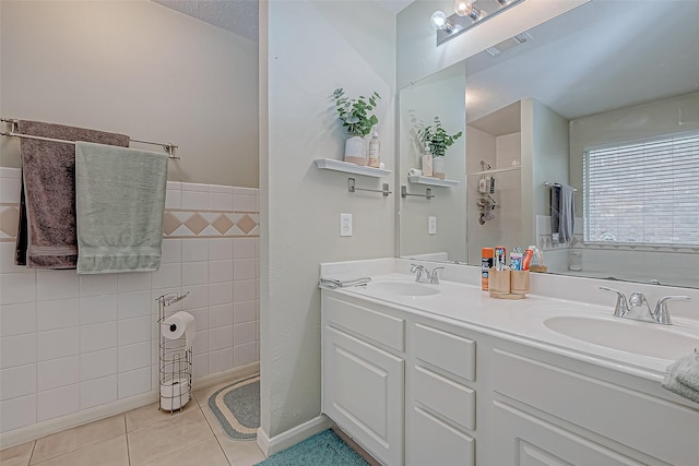 bathroom with tile patterned floors and vanity