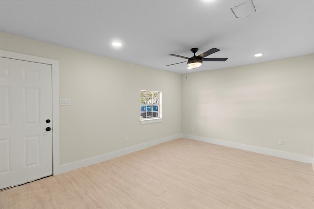 unfurnished room with ceiling fan and light wood-type flooring