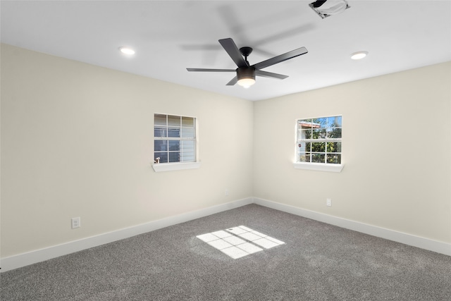 spare room featuring carpet floors and ceiling fan