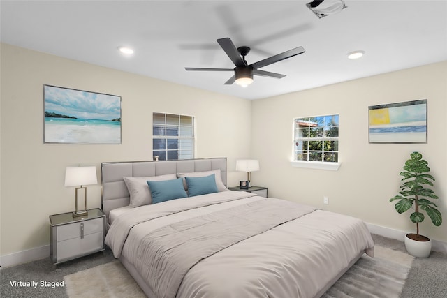 carpeted bedroom with ceiling fan