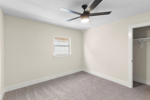 unfurnished bedroom with carpet flooring, ceiling fan, and a closet