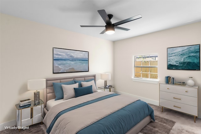 bedroom with light colored carpet and ceiling fan