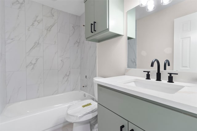 full bathroom featuring vanity, toilet, and tiled shower / bath combo