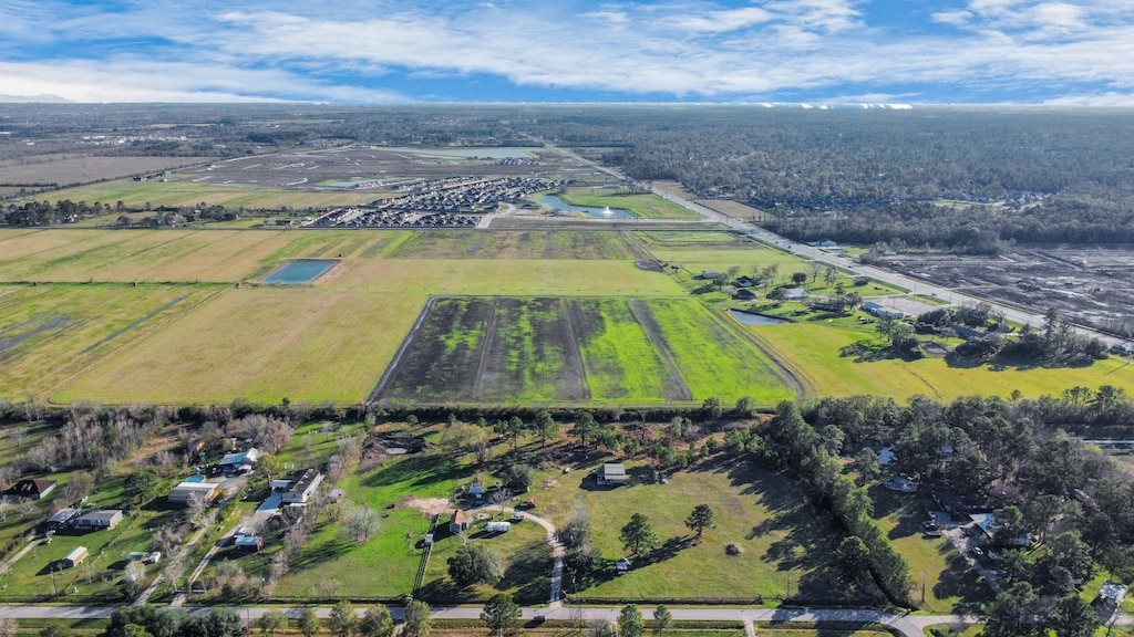 birds eye view of property featuring a rural view