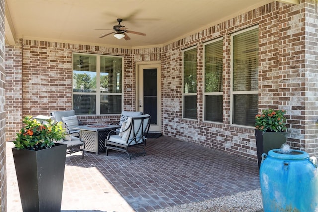 view of patio featuring ceiling fan and an outdoor living space