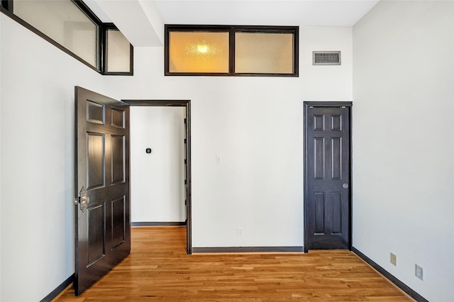 spare room with light hardwood / wood-style floors