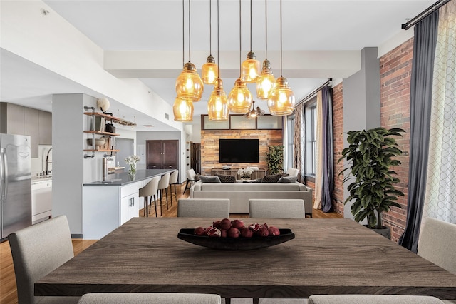 dining area featuring a notable chandelier and light wood-type flooring