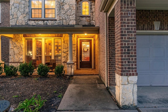 view of exterior entry with covered porch