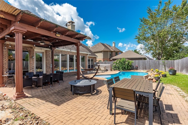 view of pool featuring a patio area and ceiling fan