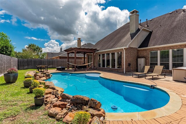 view of swimming pool featuring a pergola and a patio