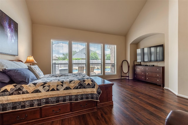 bedroom featuring dark hardwood / wood-style flooring and lofted ceiling