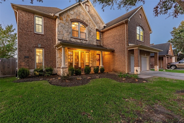 view of front facade with a front yard and a garage