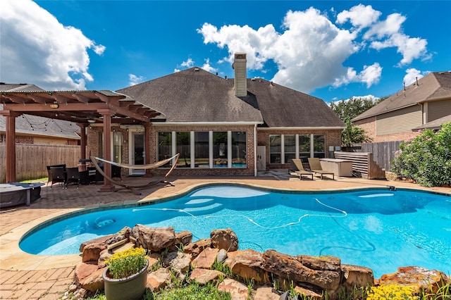 view of swimming pool with a pergola and a patio area