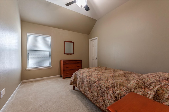 bedroom featuring light carpet, ceiling fan, and lofted ceiling