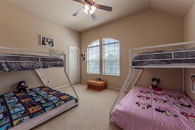 bedroom featuring ceiling fan, lofted ceiling, and light carpet