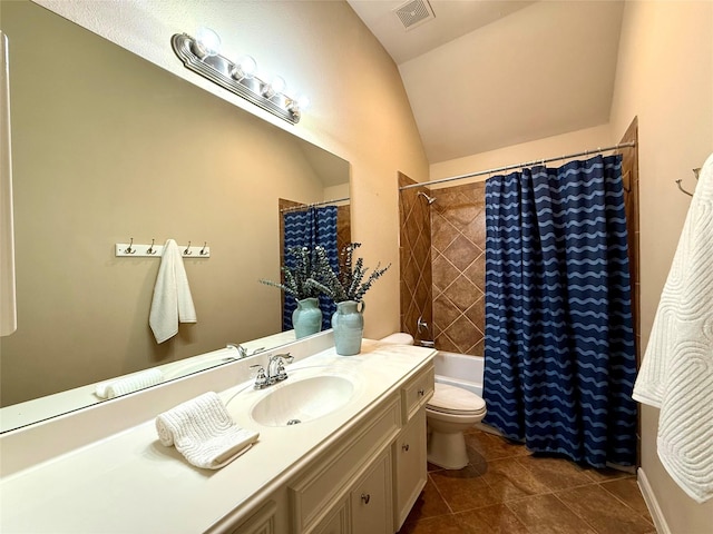 full bathroom with shower / tub combo, tile patterned floors, vanity, vaulted ceiling, and toilet