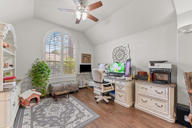 office space featuring ceiling fan, vaulted ceiling, and wood finished floors