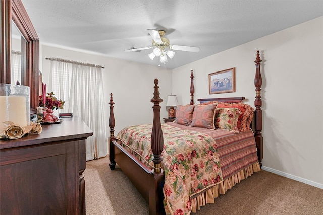 bedroom with a textured ceiling, ceiling fan, baseboards, and light colored carpet