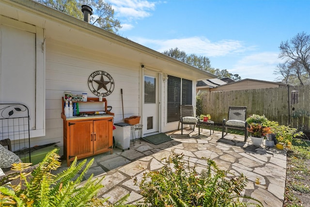 view of patio featuring fence