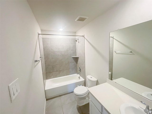 full bathroom featuring tile patterned flooring, vanity, toilet, and tiled shower / bath